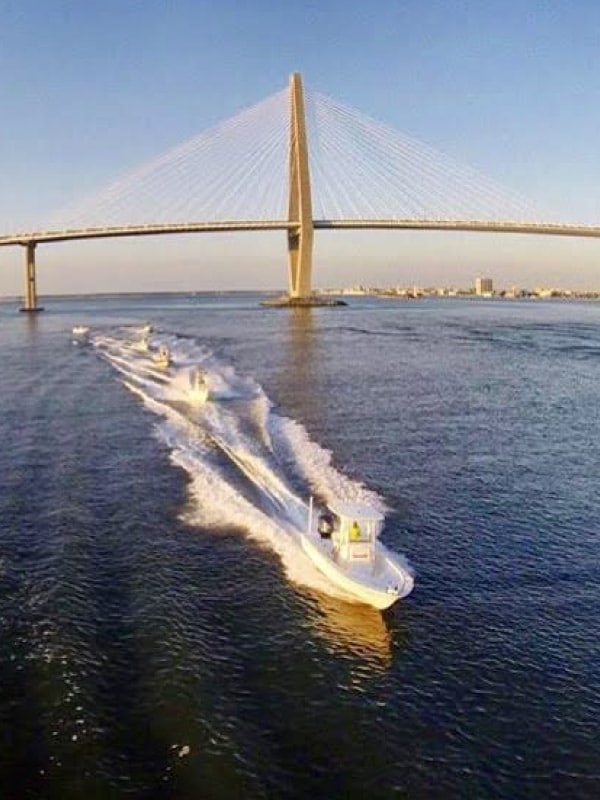 Charleston Harbor tours with boat cruising under the Cooper River Bridge