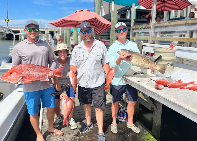 A group of guys that caught Red Snapper during nearshore fishing trip in Charleston